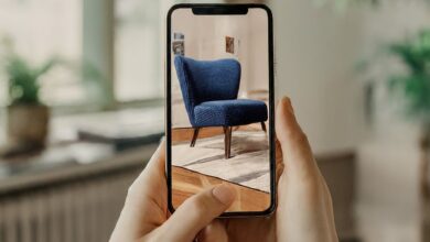 10 Incredible Things You Can Do with Your Smartphone A smartphone showing an AR home design app with a virtual piece of furniture placed in a real room 1